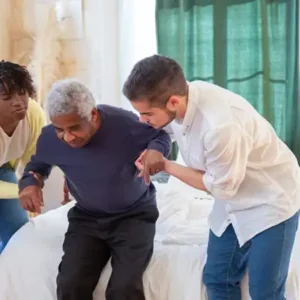 Picture of Nursing home personnel helping a person